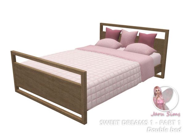 the bed is made with pink sheets and pillows