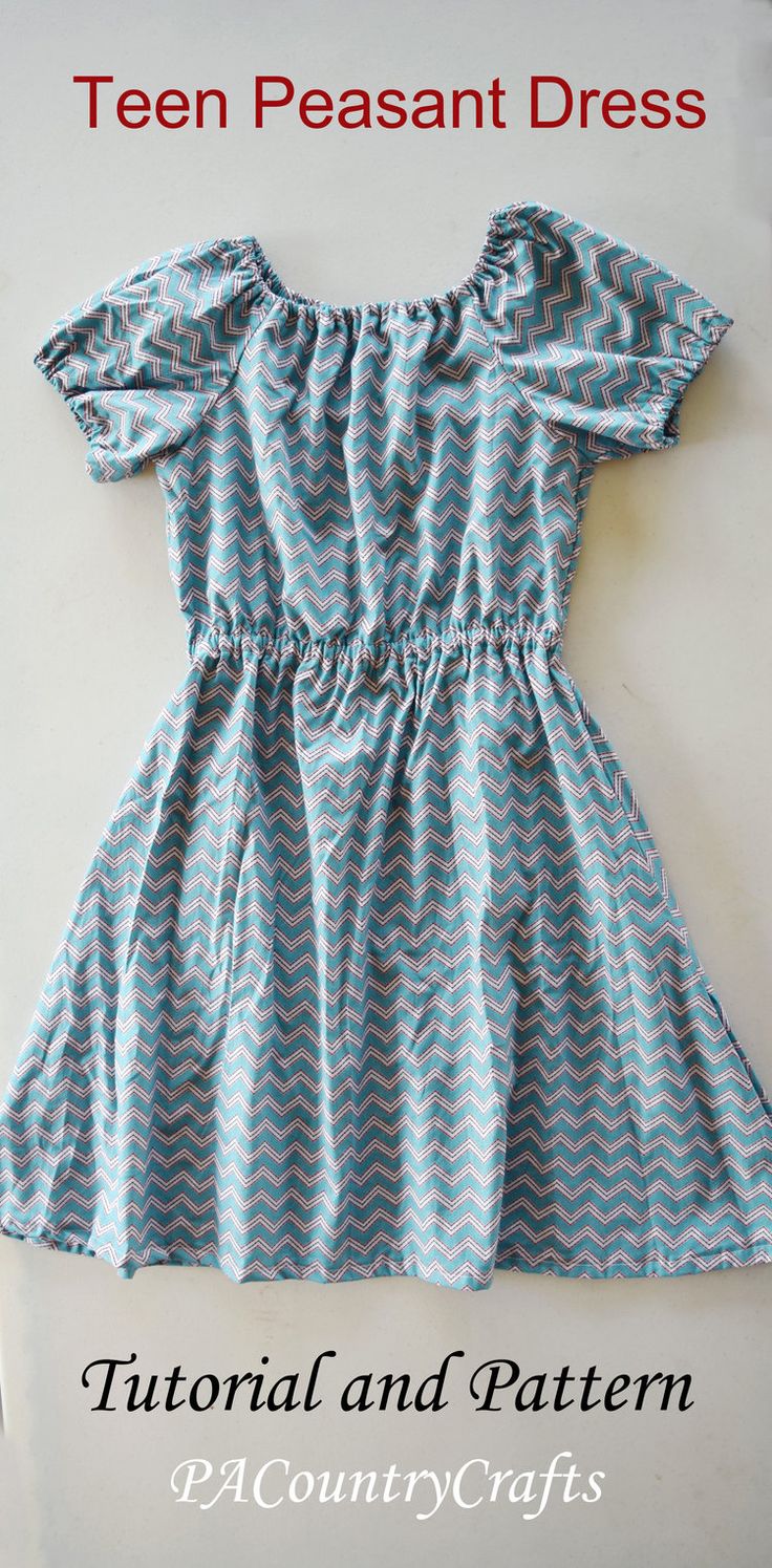 a blue dress with white chevrons on it and the words, teal peasant dress