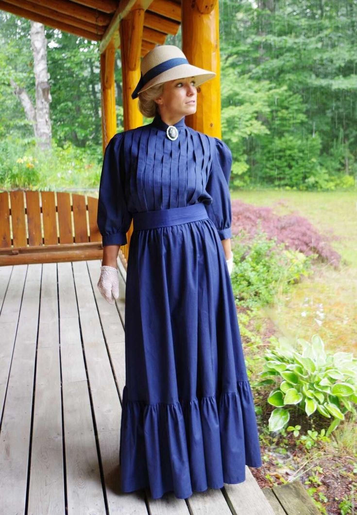 Classic Edwardian styled cotton very versatile 3-piece set! The blouse has shoulder to hem vertical pleating, 3/4 length full sleeves gathered to a cuff, button back, and center front split turn back collar. The skirt has a wide flounce with an elastic waist. The waist is wrapped with a matching cotton belt. Designed and made by Recollections in America. 100% cotton. Hand or machine wash cold gently; hang or tumble dry low. Leisa is wearing a brooch, hat, gloves, and boots and they are priced se Classic Fitted Long Sleeve Prairie Dress, Fitted Long Sleeve Dress With Pintucks, Fitted Long Sleeve Prairie Dress With Gathered Sleeves, Cotton Victorian Long Sleeve Dress For Fall, Long Sleeve Cotton Victorian Dress For Fall, Fall Victorian Long Sleeve Cotton Dress, Cotton Victorian Dress For Formal Occasions, Regency Style Long Sleeve Prairie Dress For Fall, Peasant Style Victorian Dress For Daywear