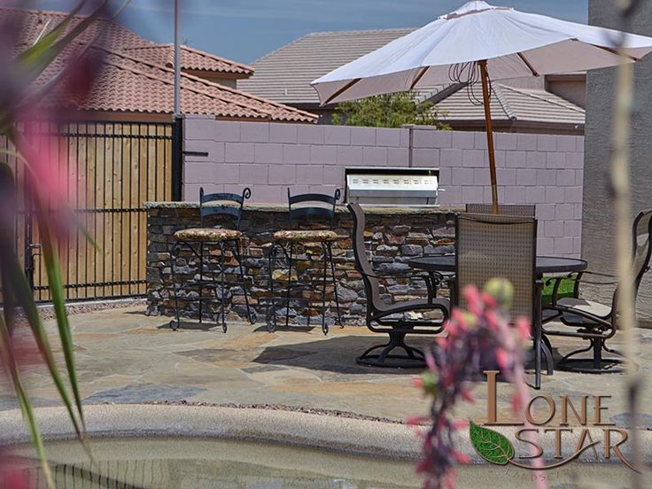 an outdoor dining area with chairs and umbrellas