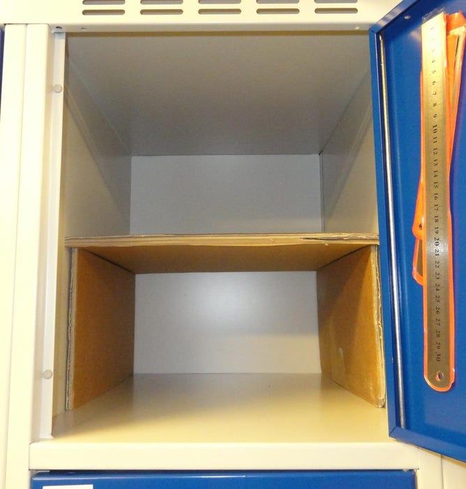 the inside of a blue and white locker with an orange handle on it's door