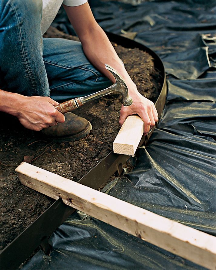 a man is working on something in the dirt