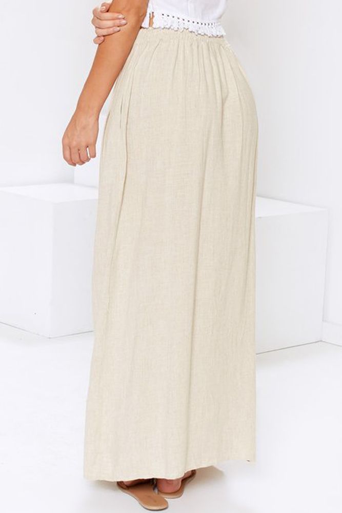 Beige Buttoned Maxi Skirt Beige Tiered Lined Skirt, Beige Long Maxi Skirt For Vacation, Beige Lined Skirt Bottoms For Vacation, Beach Pleated Skirt Bottoms, Beige Skirt With Elastic Waistband For Beach, Beige Maxi Skirt With Elastic Waistband, Relaxed Beige Skirt For Vacation, Beige Lined Skirt For Vacation, Beige Relaxed Skirt For Vacation