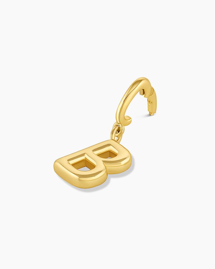 Description Personalize your favorite chain necklace with this playful helium alphabet charm. Wear your initials or a loved one's - you can make a set here. Product Details Total drop 11/16" Letter measures 5/16" by 3/8" Hinge closure measures 3/16" by 5/16" Available in 18k gold plated brass Avoid contact with anything containing derivatives of alcohol Personalized Yellow Gold-plated Charms, Personalized Gold Charms For Everyday, Personalized Yellow Gold Plated Charms, Everyday Yellow Gold Pendant Charms, Personalized Yellow Gold Charms For Everyday, Everyday Yellow Gold Jewelry With Logo Charm, Gold Initial Pendant Charms, Gold Classic Initial Necklace With Charms, Everyday Monogram Yellow Gold Jewelry