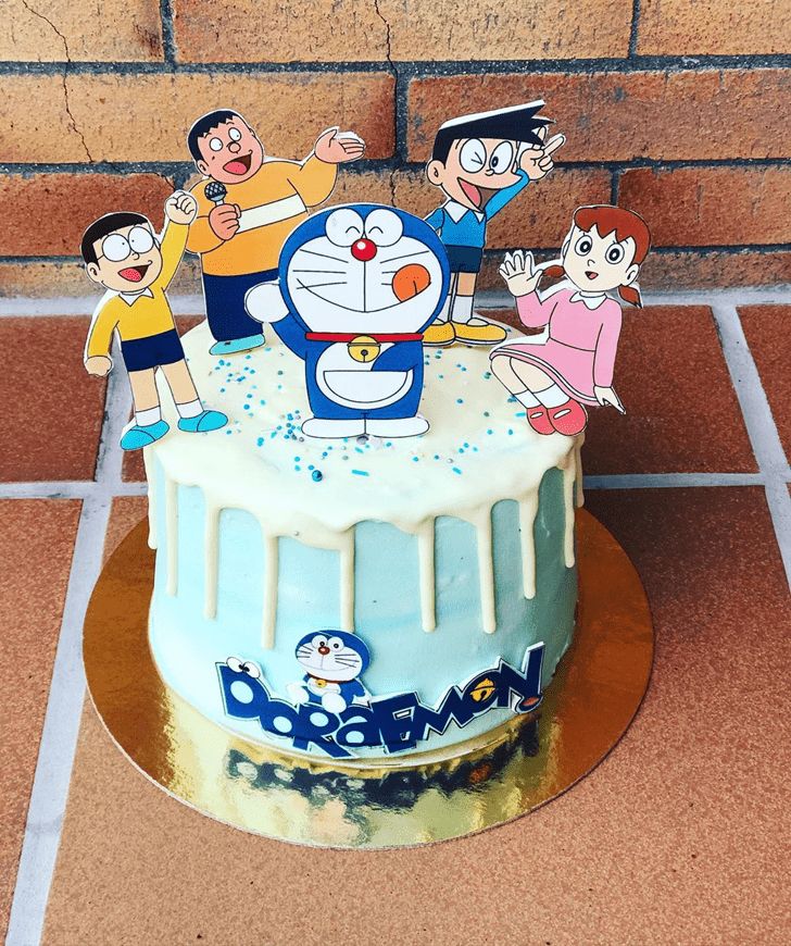 a birthday cake with cartoon characters on it