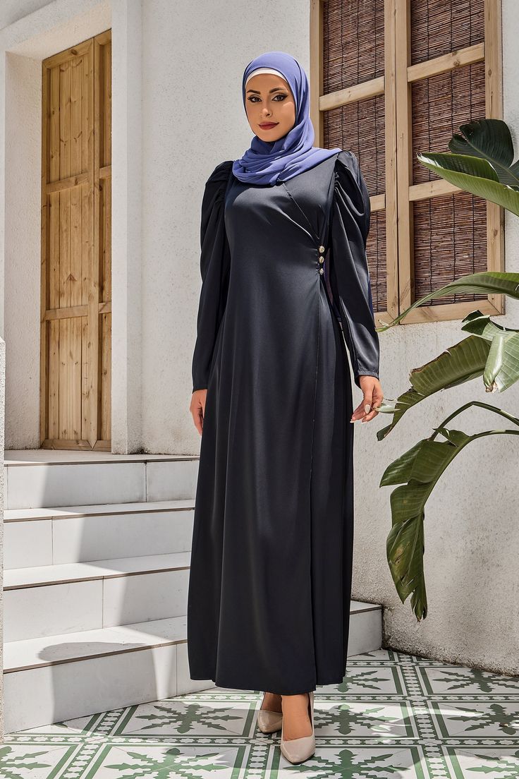 The Black Criss Cross Puff Sleeve Maxi Dress is made of luxurious satin fabric with a stunning shine perfect for any event. It featured a V-neck neckline, criss cross faux wrap around waist, and three buttons side detail. The maxi hemline which adds to make the dress an eye catching look. Perfect for Eid holidays, weddings, and more events. Criss cross faux wrap Hidden back zipper Regular fit True to size Satin Lined Model is 5'10" wearing a size S Eid Holiday, Puff Sleeve Maxi Dress, Tie Maxi Dress, Swimsuits Outfits, Maxi Cardigan, Sleeve Maxi Dress, Abayas Fashion, Maxi Dress With Sleeves, Satin Fabric