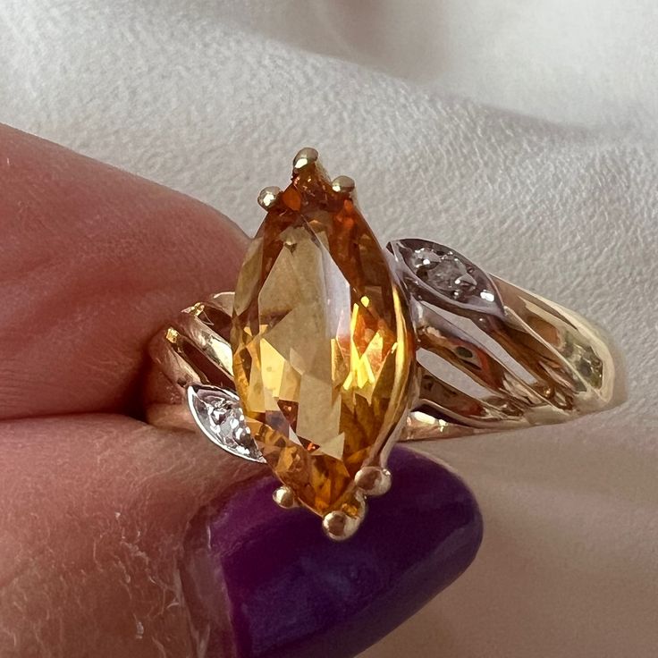 Beautiful Vintage Ring In Solid 14k Yellow Gold ( Stamped And Also Tested) , With A Marquise Cut Natural Citrine Stone And Tiny Diamond Chips. Citrine Stone Is Approx.12mm Long By6mm Wide. It Is A Size 7 On Ring Mandrel And Weights 3.20 Grams. Very Solid Made, Stunning Golden Color, Truly Gorgeous Ring! Citrine Marquise Ring, Classic Yellow Gold Topaz Ring With Gemstone Accents, Fine Jewelry Marquise Cut, Yellow Gold Diamond Cut Topaz Ring, 14k Gold Heirloom Birthstone Ring, Elegant Topaz Ring, Classic Marquise Jewelry With Accent Stones, Gold Diamond Cut Topaz Ring, 14k Gold Topaz Ring With Diamond Cut