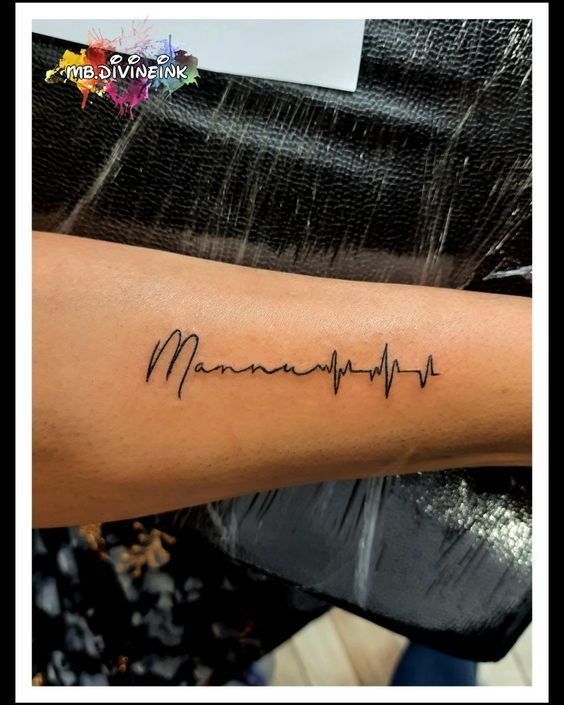 a woman with a heartbeat tattoo on her arm