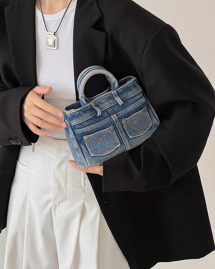 This Blue Jeans Mini Handbag comes in the shape of folded jeans, combining the iconic Y2K denim look with trendy mini size Size: 22*8*15 cm / 8.7*3.1*5.9 in Material: Denim Trendy Denim Blue Shoulder Bag, Trendy Blue Denim Shoulder Bag, Trendy Medium Wash Denim Shoulder Bag, Trendy Denim Blue Denim Bag, Folded Jeans, Aesthetic Store, Indie Aesthetic Outfits, Iconic Y2k, Find Your Aesthetic