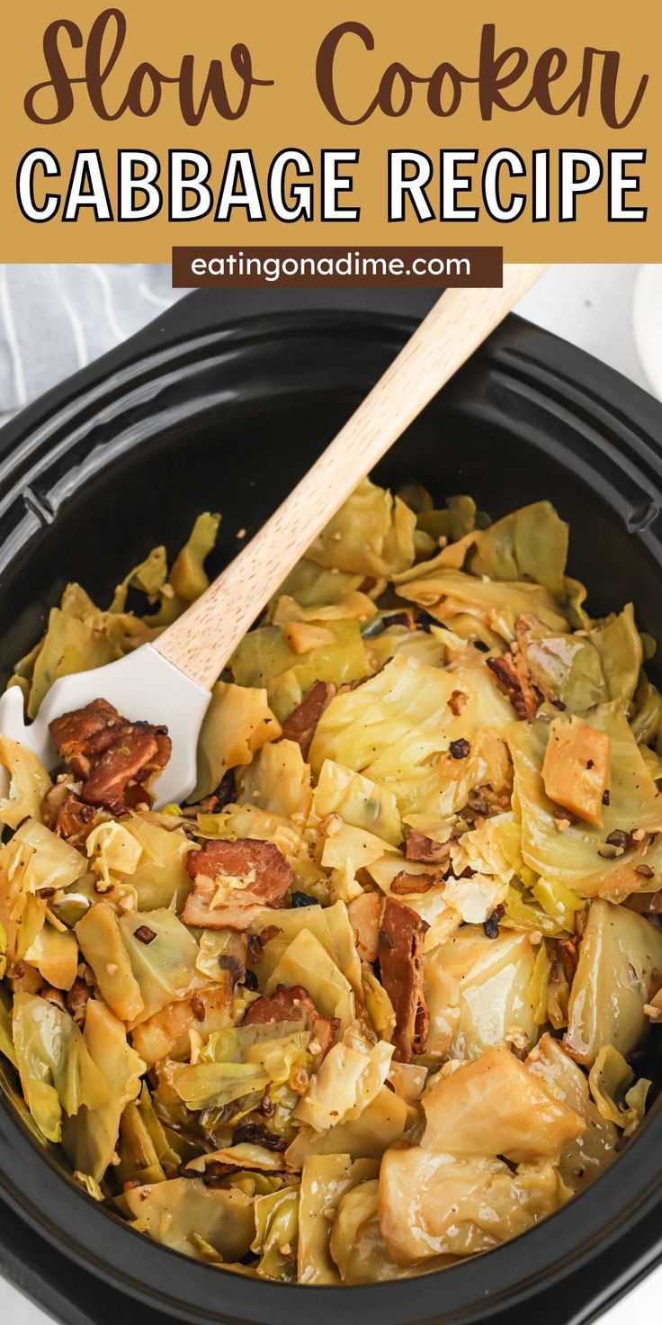 slow cooker cabbage recipe in a black crock pot with a wooden spoon inside