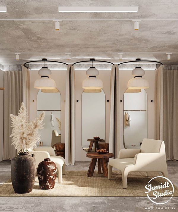 a living room filled with white furniture and tall vases on top of a rug