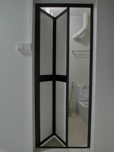 a room divider in the corner of a bathroom