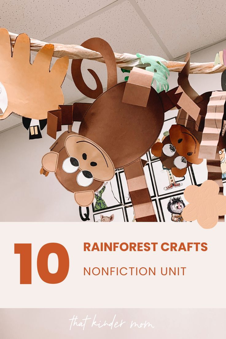 paper animals hanging from the ceiling with text overlay reading 10 rainforest crafts nonfuction unit