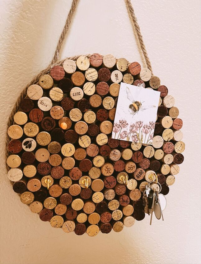 a wine cork board hanging on the wall