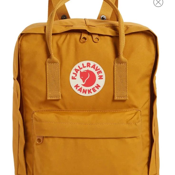 * Measures: H 38cm X W 27cm X D 13cm * Volume: 16 L * Activity: Everyday Outdoor * Family: Kanken * Gender: Unisex * Environmental Info: Fluorocarbon-Free Impregnation * Features: Durable, Quick-Drying, Water-Resistant Fjallraven Kanken Backpack Acorn, Fjallraven Kanken Colors Chart, Fjallraven Kanken Grande, Fjallraven Kanken Dahlia, Fjallraven Kanken Blue Ridge, Fjallraven Ochre, Vintage Fjallraven, Ochre Color, Warm Yellow