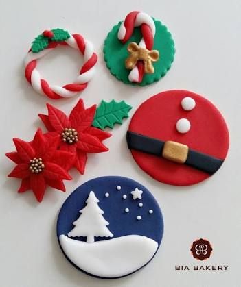 christmas cookies decorated with holiday decorations on a table