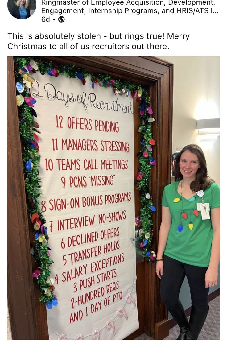 a woman standing in front of a sign that says days of the week on it