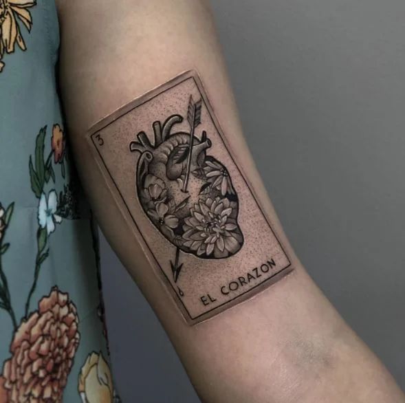 a woman's arm with a tattoo on it that says l'coran