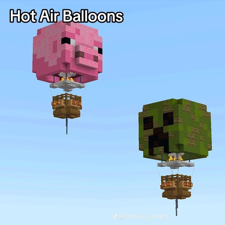 two hot air balloons floating in the sky