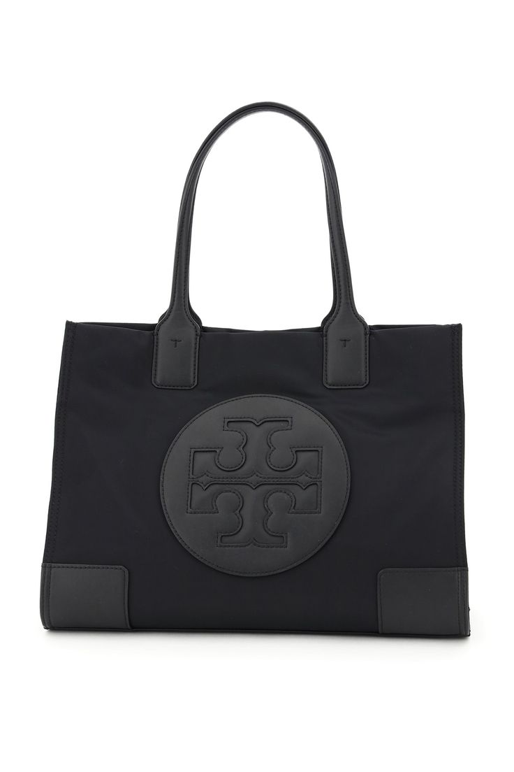 Outside: 100% Recycled nylon Finishing: 100% Leather Tory Burch Camera Bag, Tory Burch Ella Tote, T Monogram, Ella Tote, Tory Burch Ella, Tory Burch Crossbody, Tory Burch Wallet, Tory Burch Tote, Side Snap