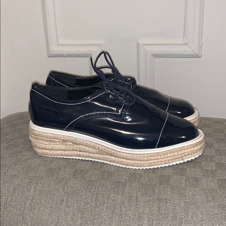 Navy Patent Leather Lace Up Loafers With A Woven Platform Base. Never Worn. Excellent Condition. Spring Patent Leather Oxfords For Office, Spring Office Patent Leather Oxfords, Spring Patent Leather Platform Loafers, Casual Summer Oxfords For Workwear, Spring Patent Leather Round Toe Oxfords, Spring Round Toe Patent Leather Oxfords, Casual Patent Leather Loafers With Rubber Sole, Spring Low-top Platform Oxfords, Casual Patent Leather Platform Loafers For Work