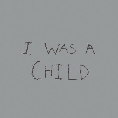 the words i was a child written in black ink on a gray background