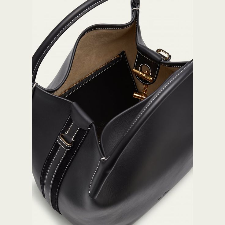 Loro Piana "Bale" bag in leather  Two carry handles  Adjustable, detachable strap  Contrast stitching  Logo accent  Wipe clean Made in Italy Leather Bucket Bag With Top Carry Handle For Office, Designer Shoulder Bag With Round Handle For Everyday, Leather Hobo Bag With Top Carry Handle For Office, Classic Hobo Bag With Detachable Top Handle, Classic Hobo Bag With Detachable Strap And Top Handle, Designer Bucket Bag With Leather Handles For Office, Leather Office Bucket Bag, Leather Office Bucket Bag With Handle Drop, Luxury Satchel Hobo Bag