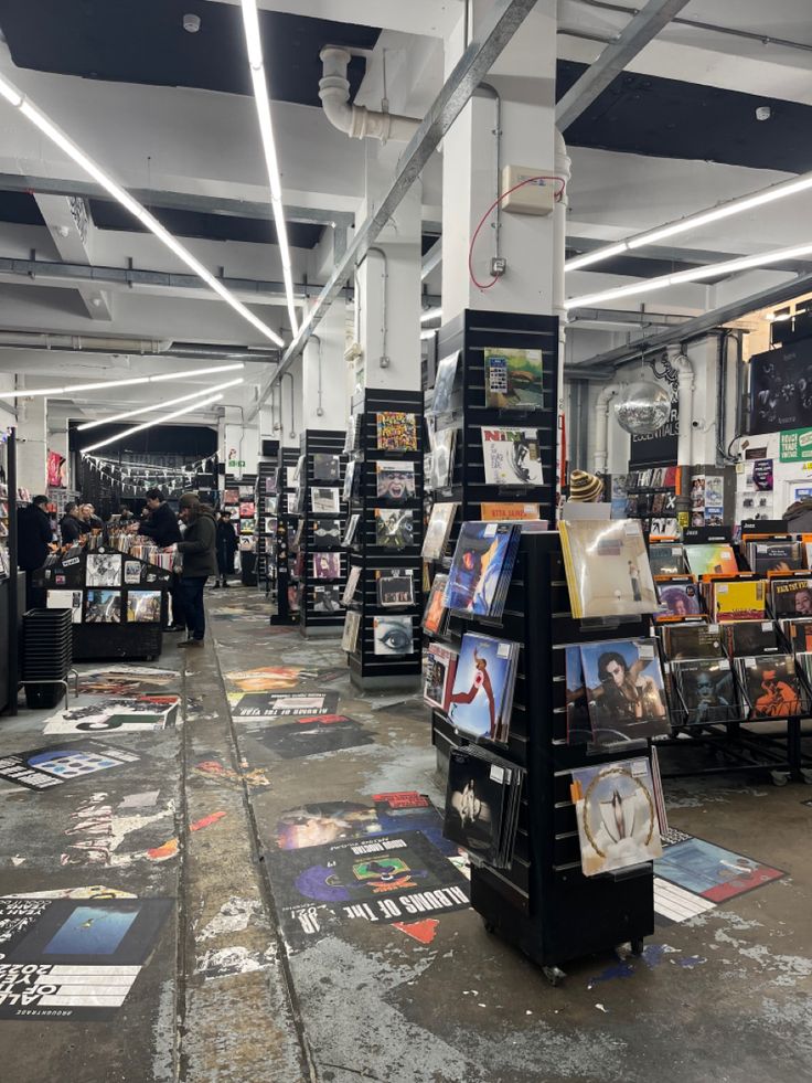 an open book store with lots of books on the floor