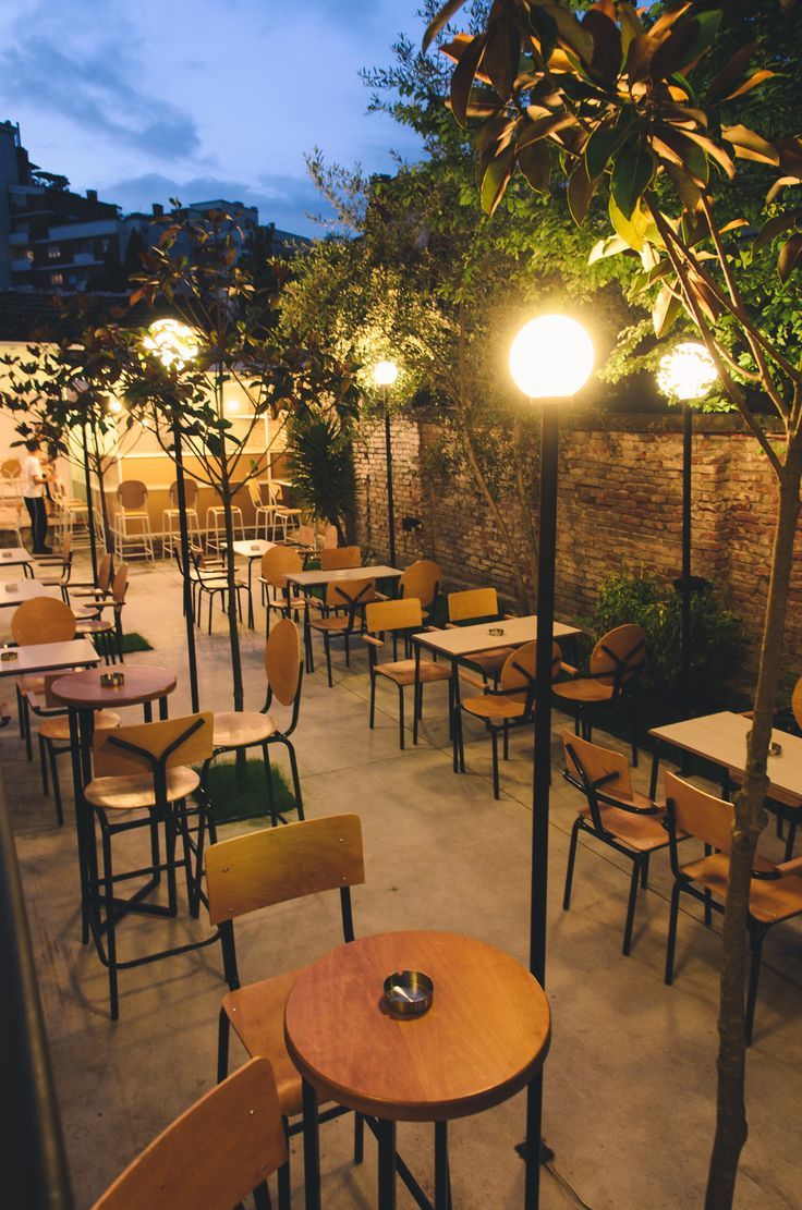 tables and chairs are lined up outside at night