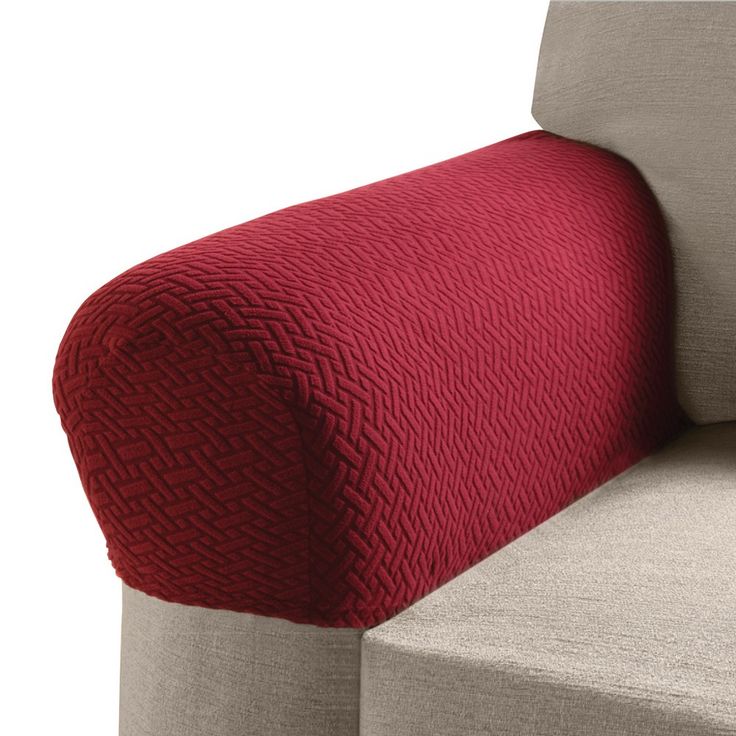 the back of a couch with a red cover on it's arm and side