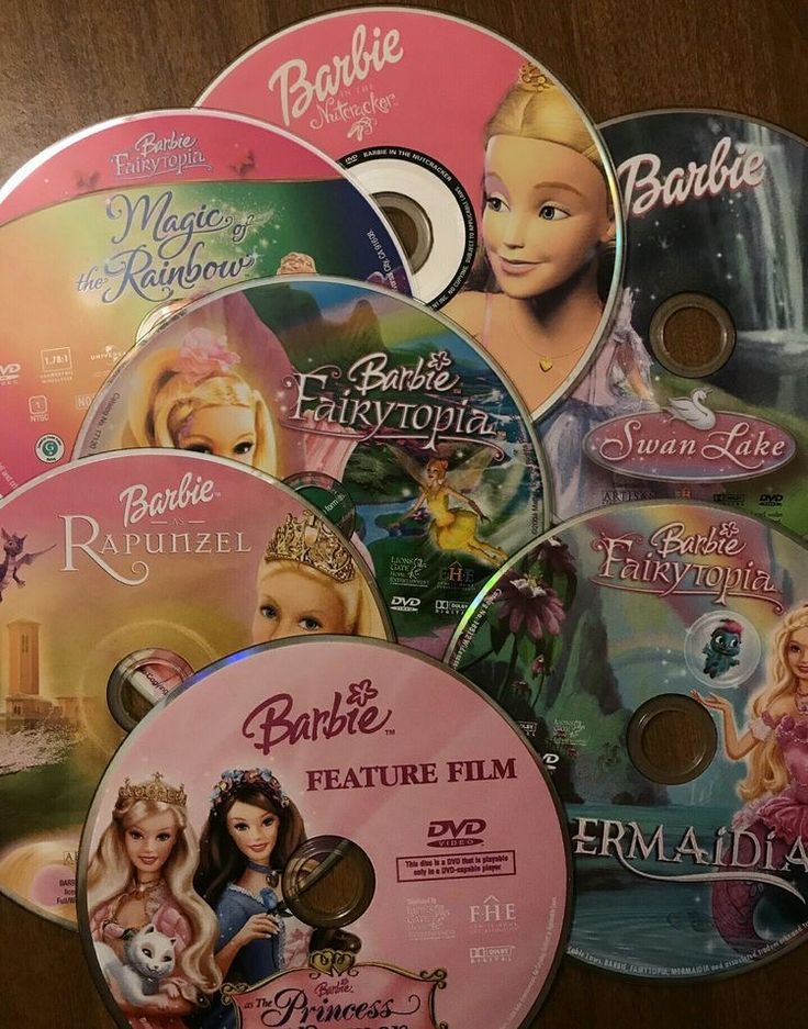 barbie dvd's are stacked on top of each other