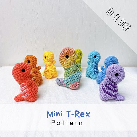 small crocheted seahorses sitting in a row on a white surface with the words mini - t - rex written below them