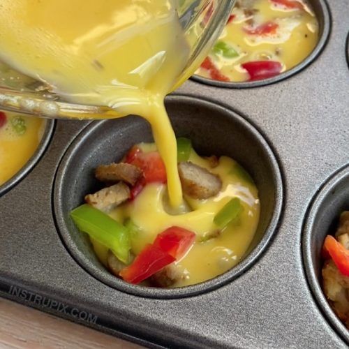 someone pouring dressing into a muffin tin filled with food