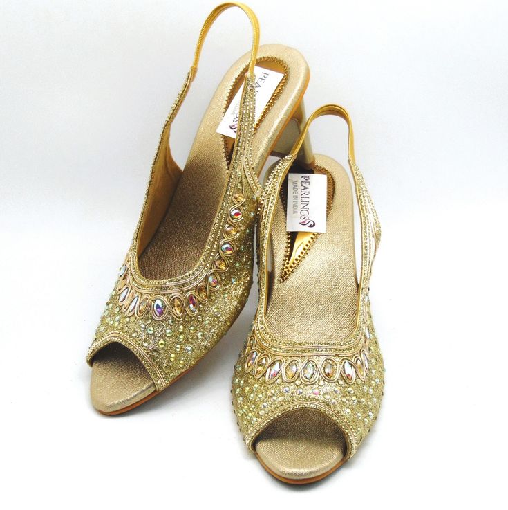 Check out our new collection of designer wedding shoes which we offer for you. These beautiful shoes are Rosegold with real Crystals work on embroidered all around the shoe and round front shaped. These are extremely comfortable wedding shoes with a low heel these are comfortable to wear for long hours. These are perfect for your wedding or a formal event. These bridal shoes offer a heel size of 3 Inches. Don't miss out on these beauties! See our page for more of our collection! We ship out in a timely matter, wrapped in care for a safe secure trip to your location. Thank you for supporting our small business! Shipped from USA. Sizes available US 6,7,8,9,10 Gold Slip-on Heels For Wedding, Gold Slip-on Heels For Formal Occasions, Gold Slip-on Heels For Evening, Gold Open Toe Wedding Shoes For Formal Occasions, Elegant Festive Heels For Evening, Elegant Evening Heels For Festive Occasions, Elegant Festive Evening Heels, Gold Low Heel Wedding Shoes For Formal Occasions, Elegant Party Court Shoes Slip-on