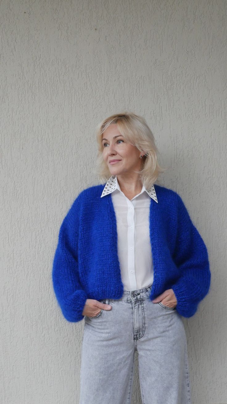 "Fluffy mohair cardigan for cozy outfit. Suits perfectly for any occasion and looks great. Soft bomber cardigan is a great idea for gifting. The material of this cardigan consists of mohair, wool and acrylic. The mohair has a beautiful long fiber which gives a soft and luxurious look. On a photo in Electric Blue color 05 in M size. For XS - S Length 20\" - 52 cm Width 18\" (46 cm) (under the arms) For M Length 20\" - 52 cm Width 19\" (50 cm) (under the arms) For L Length 21\" - 54 cm Width 21\" Long Blue Cardigan Outfit, Mohair Casual Cardigan For Layering, Casual Mohair Cardigan For Layering, Mohair Cardigan For Layering, Soft Knit Mohair Cardigan, Winter Blue Open Knit Cardigan, Casual Blue Mohair Sweater, Casual Mohair Outerwear With V-neck, Blue Cardigan Outfit