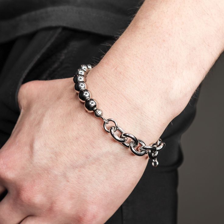 DESCRIPTION:This Mitte silver steel bead and chain adjustable signature bracelet provides a sophisticated and contemporary style. Crafted with premium stainless steel chain and hand strung beads, this bracelet is waterproof and will not turn your skin green. Waterproof and tarnish resistant, this attractive bracelet is a modern and durable accessory.DETAILS: available in 6.5 and 7.5 with 1.5 inches tail chain stainless steel adjustable closure industrial modern FIT:Model has a 6.5 inch wrist and is wearing the 6.5 sizing Trendy Silver Beaded Bracelet With Adjustable Chain, Silver Beaded Chain Bracelet As Gift, Silver Beaded Chain Charm Bracelet Gift, Silver Beaded Chain Bracelets For Everyday, Metal Chain Bracelet With Silver Beads As A Gift, Gift Metal Chain Bracelet With Silver Beads, Modern Adjustable Beaded Chain Jewelry, Adjustable Modern Metal Charm Bracelet, Silver Bracelets With Round Beads And Adjustable Chain