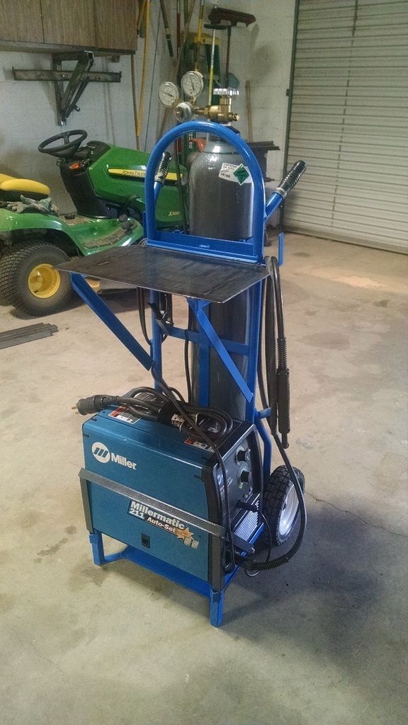 a small blue machine in a garage