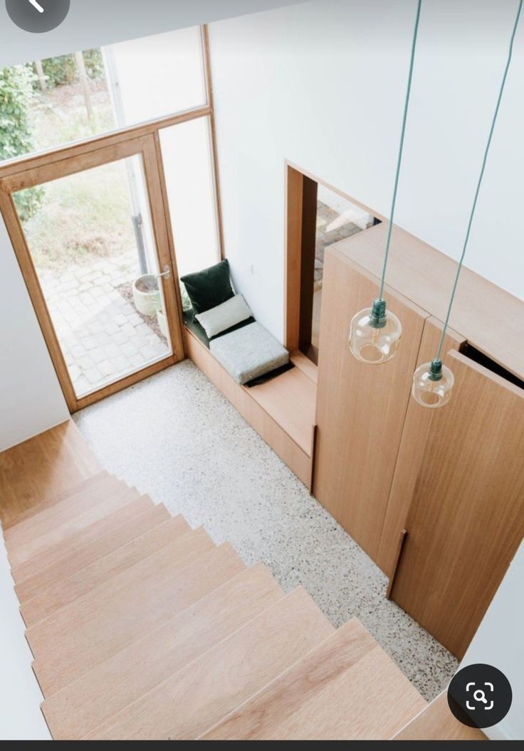 an overhead view of a living room and stairs