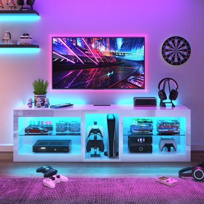 a living room filled with furniture and neon lights