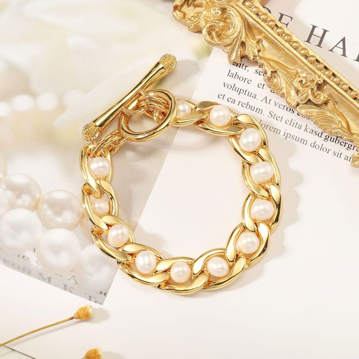 A perfect present for any special event, our Pearl Twist Bracelet is crafted with genuine brass and beautiful pearls. An elegant and stylish accessory, this luxe bracelet is sure to add a touch of sophisticated grace to any occasion. A truly unique and timeless piece, make this the gift of choice for an unforgettable celebration. DETAILS Plating: 18k Gold Materials:   18K Gold on Brass, Freshwater Pearl Measurements: Length: 6.30"(16.0cm) Weight:  36.3g Twist Bracelet, Toggle Clasp Bracelet, Pearl Jewelry Gift, 18k Gold Bracelet, Unique Gift Wrapping, Twisted Bracelet, Cuban Link Chain Necklaces, Opal Pendant Necklace, Enamel Necklaces