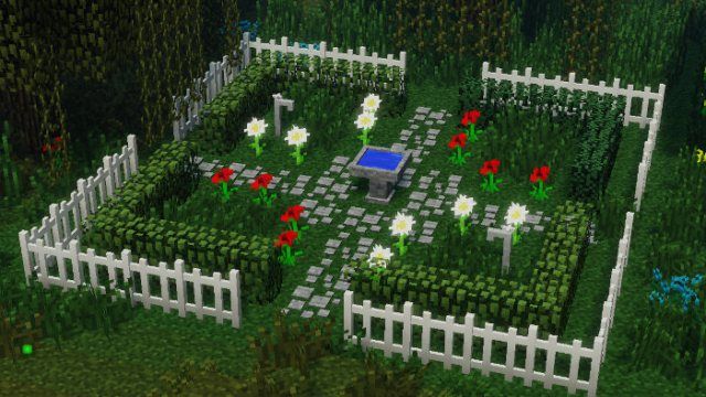 an image of a garden in minecraft with flowers on the ground and trees around it