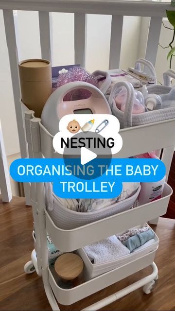 a baby crib with lots of items in it and the words nesting organizing the baby trolley