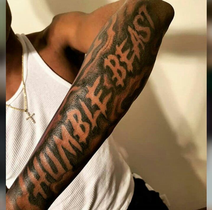 a man with a tattoo on his arm