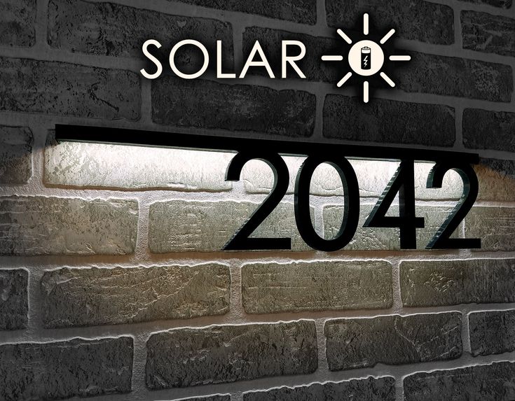 a brick wall with the number twenty four in front of it that reads solar 2012