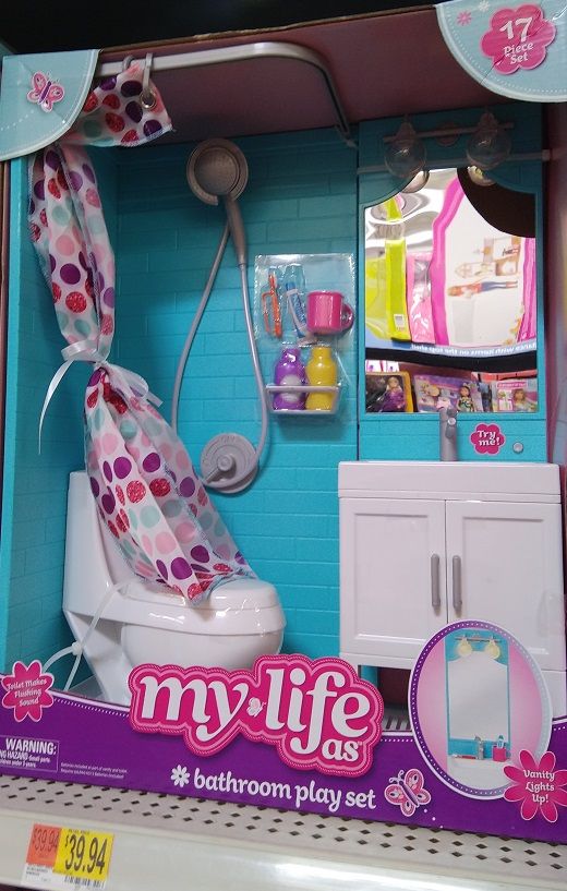 a toy bathroom set in the shape of a doll house