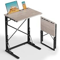 a computer desk with two laptops on it