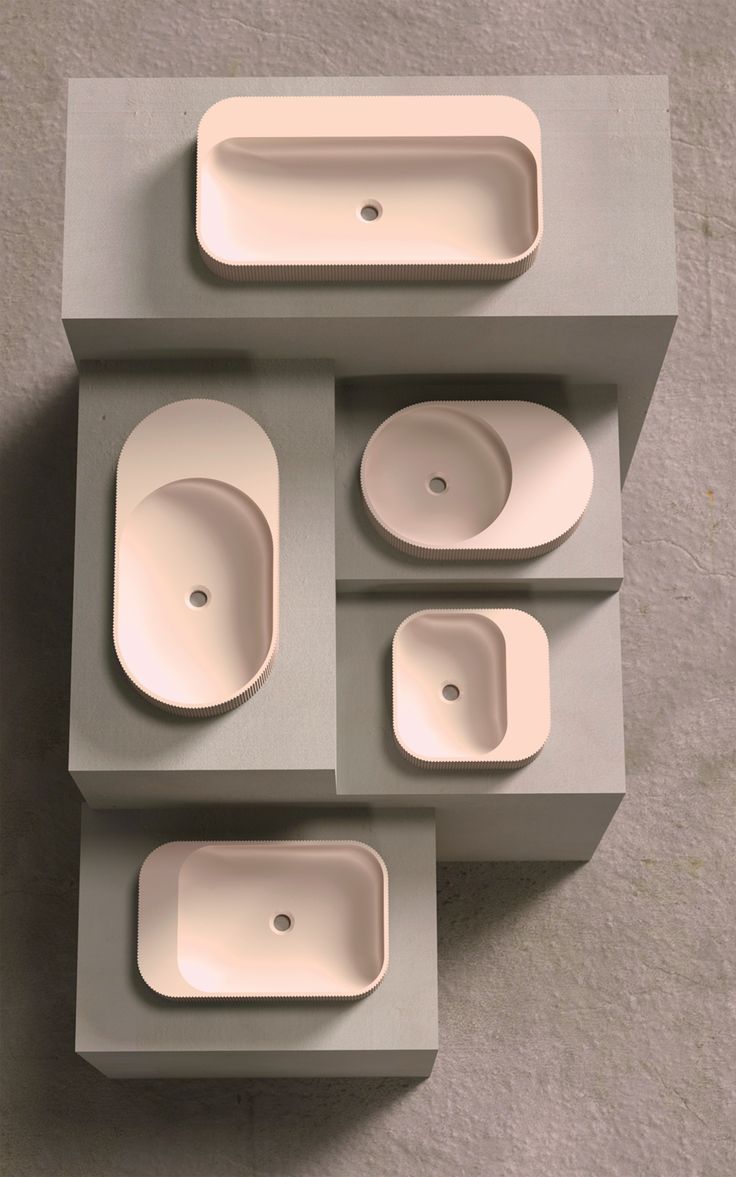 four bowls and three plates are arranged in a box on top of each other, with one empty bowl at the bottom