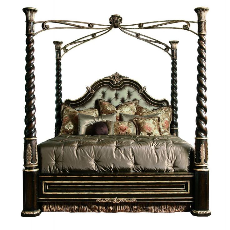 a bed with four posts and pillows on it's headboard is shown in this image