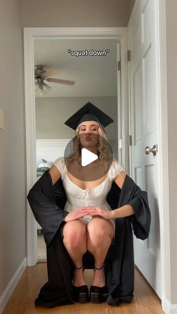 a woman sitting on top of a chair wearing a graduation cap and gown