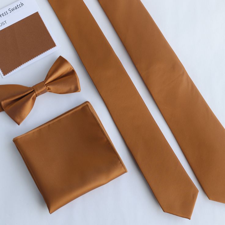 "Rust Tie, Wedding Dress Tie,Skinny Men's Wedding Tie, Groomsmen Tie, Groom Tie, Wedding Gift, Hand Made, Personalization Product Detail * TIE>> 2.5\"  at the widest point, approximately 58\" in Length (other size, please check options) * BOW TIE>> 4.3\" X 2.4\" bow, 20\" stripe adjustable * POCKET SQUARE>> 9.5\" X 9.5\" square * Handmade * 100% Microfiber * Dry Clean only F E A T U R E S 🎁Gift for Men Rust men's ties make you excellent on all formal and informal occasions. Perfect gift for Father, Husband, Boyfriend, Uncle, Son, and friend! 💌If you have any concerns or questions about my listing, feel free to contact us via Contact Shop Owner. We want you to be 100% satisfied with your purchase! ❤️Thank you for visiting my listing!" Fitted Solid Color Wedding Suits, Solid Color Fitted Suit For Wedding, Solid Fitted Suit For Wedding, Elegant Solid Color Wedding Sets, Brown Elegant Wedding Tuxedo, Classic Brown Wedding Suit And Tie Accessories, Classic Brown Suit And Tie Accessories For Wedding, Classic Brown Suit Accessories For Wedding, Fitted Brown Wedding Sets